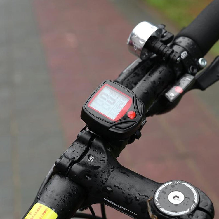 Bicycle digital speedometer with red LCD and control button on black handlebar