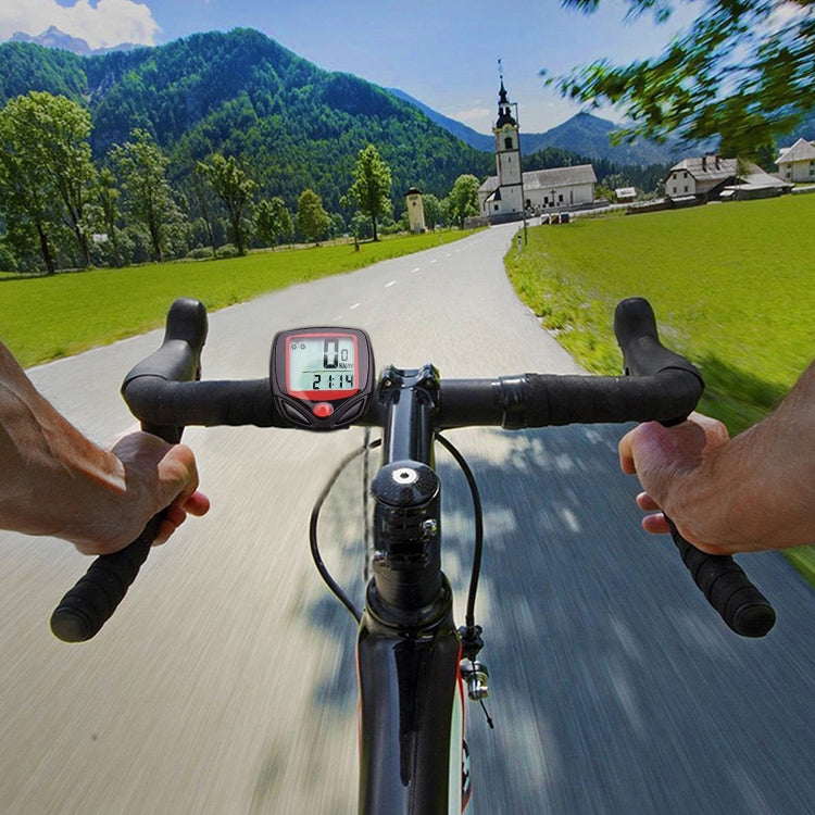 Bicycle handlebars with digital speedometer screen showing speed and distance