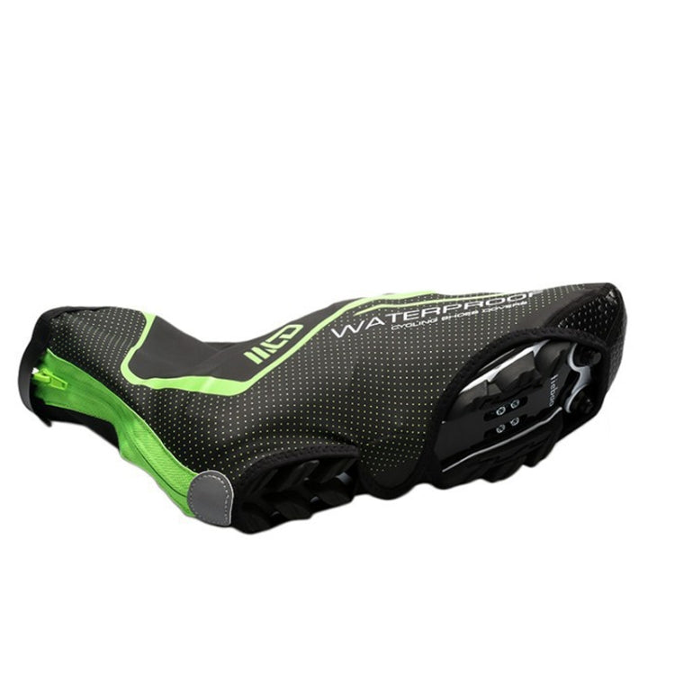 Black cycling shoe covers with neon green panels and elastic ankle opening