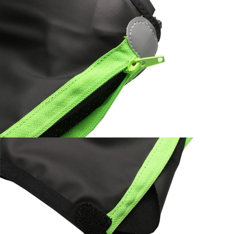 Close-up of neon green zipper on black cycling shoe cover with elastic bottom hem