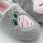 Gray cotton plush slipper close-up with pink fruit face applique and green leaf details