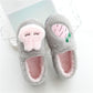 Cotton plush slippers, gray exterior with pink lining and fruit face detail