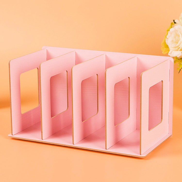 Pink wooden CD/DVD storage rack with open-front slots for organized media