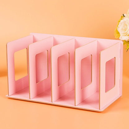 Pink wooden CD/DVD storage rack with open-front slots for organized media