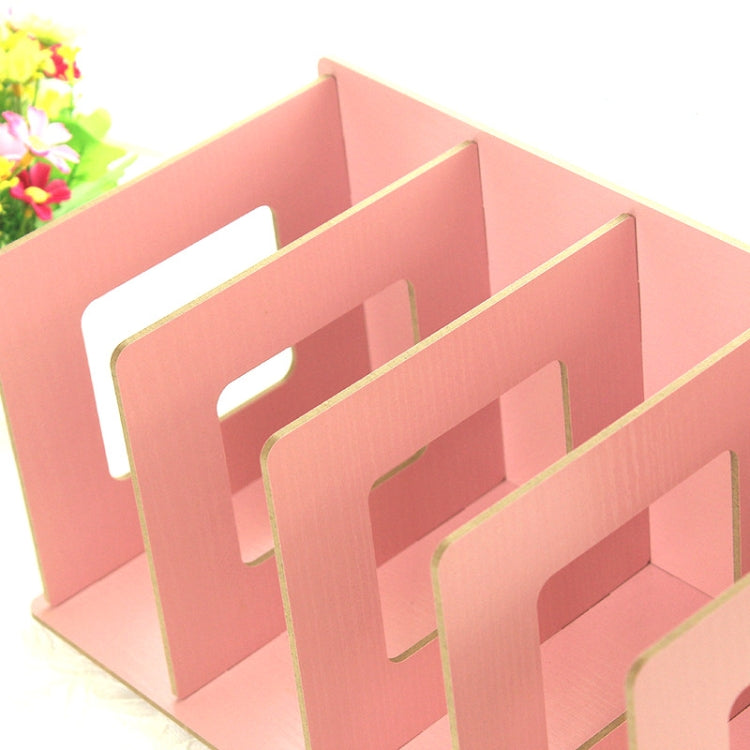 Pink wooden bookshelf-style storage rack with several open rectangular slots