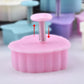 Pink spring-loaded push cake mold with metal coil post for embossing