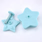 Two blue star-shaped push molds with spring posts and embossed details