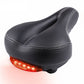 Black bicycle saddle with curved top and rear red taillight strip