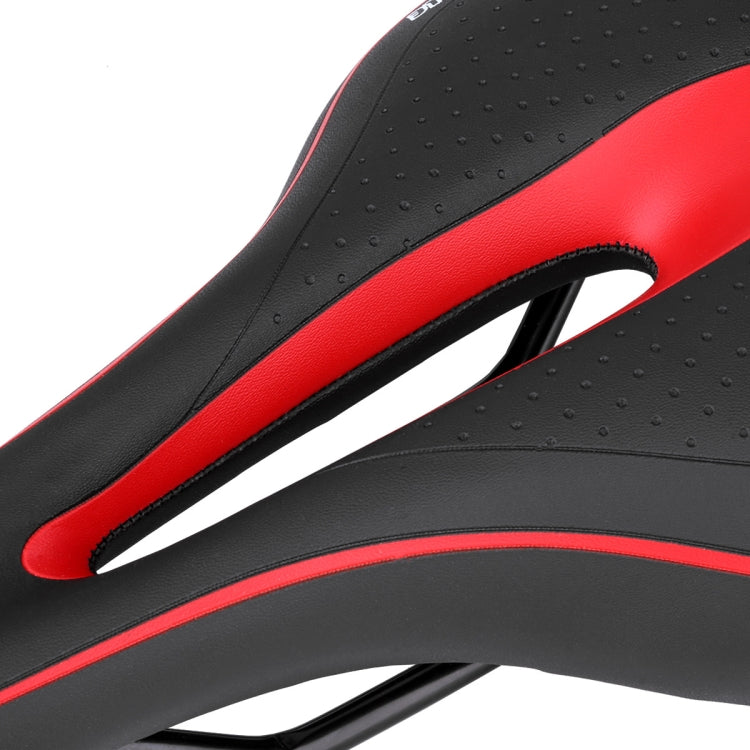 Black and red bike saddle close-up with perforations and oval cutout edge