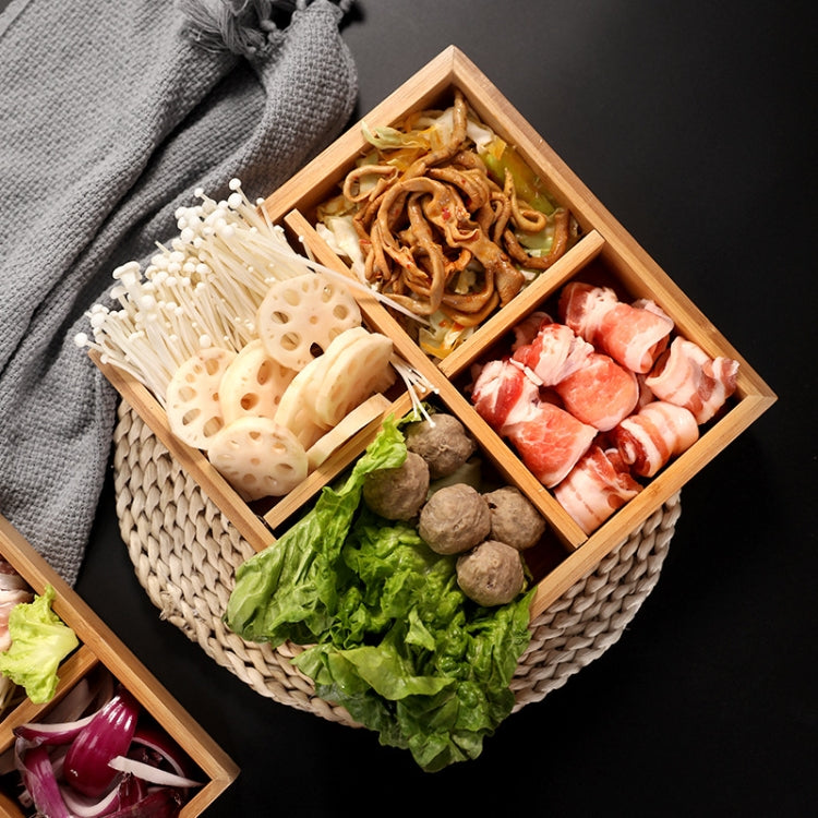 Bamboo compartment platter with divided sections filled with assorted sliced foods for serving.