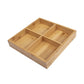 Light bamboo four-compartment grid platter with four separated square serving sections.