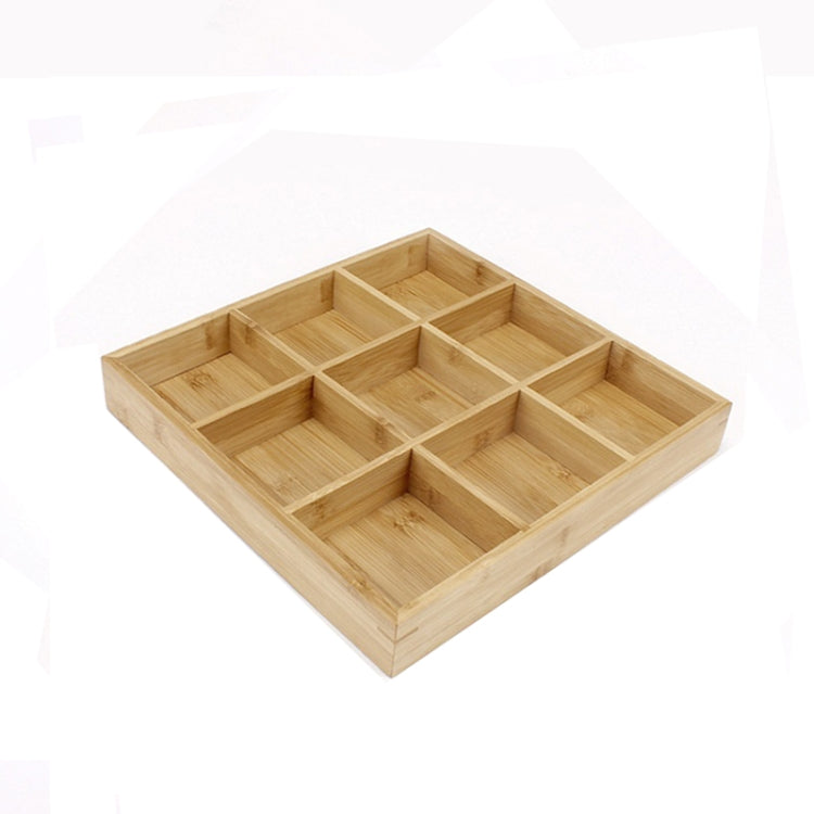 Light bamboo nine-compartment grid platter with nine separate square sections for serving.
