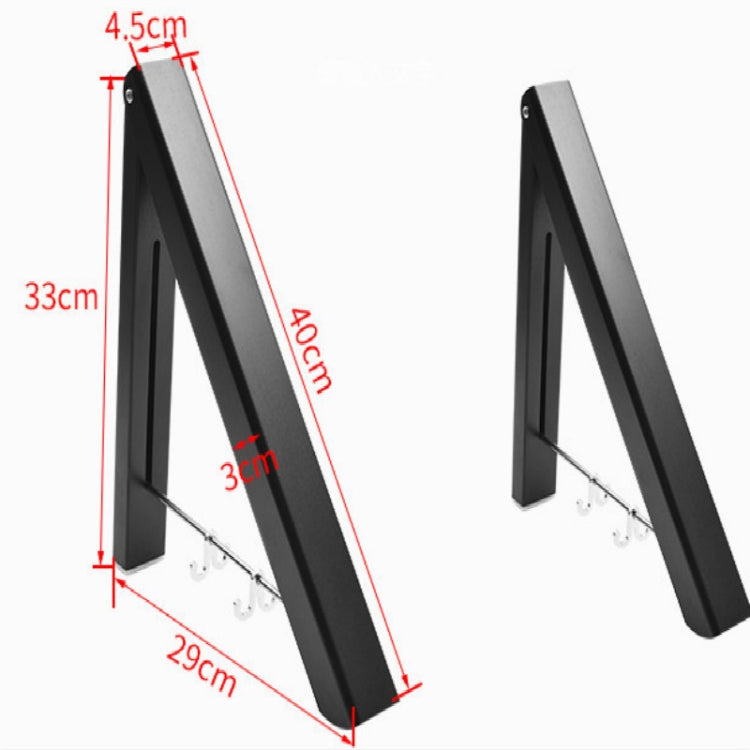 Black wall-mounted drying rack with hook arms and visible size dimensions