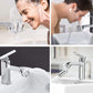 Chrome faucet dispensing filtered water over sink during hand washing