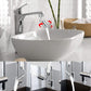 Chrome faucet over bathroom sink with filtered water stream and rotating spray