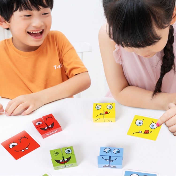 Children playing with wooden cube puzzle blocks featuring emoji faces on the table