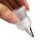 Reusable piping nozzle tip with silver insert and locking ring on the bag