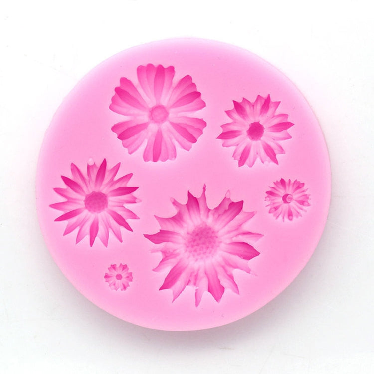 Pink silicone flower mold disc with six daisy-shaped 3D flower impressions