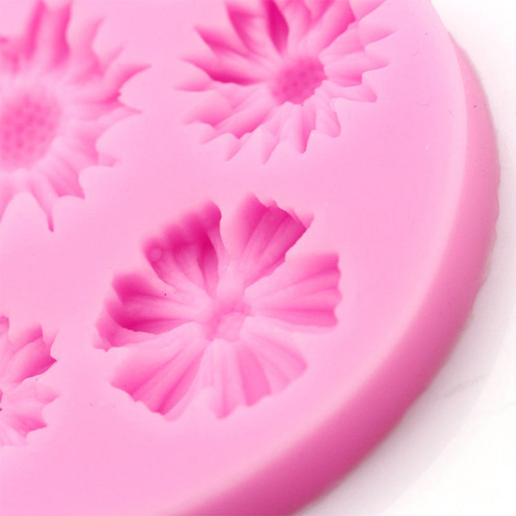 Pink silicone mold close-up of raised 3D flower petal design