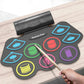 Electronic drum pad set on wood table with mallet and glowing colored pads