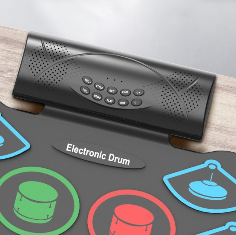 Black electronic drum controller with speaker grille and control button panel