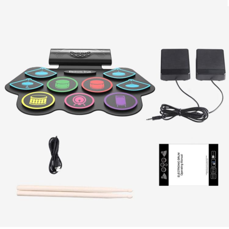 Electronic drum starter set with colored pads, drumsticks, cables, and two speakers