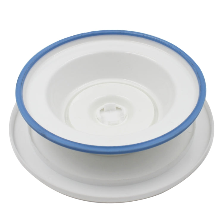 Plastic cake turntable with blue outer rim and central base mechanism