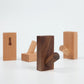 Wood wall hook with rounded peg and cutout for sticking or mounting