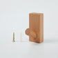 Light wood wall hook with rounded peg and included mounting screws
