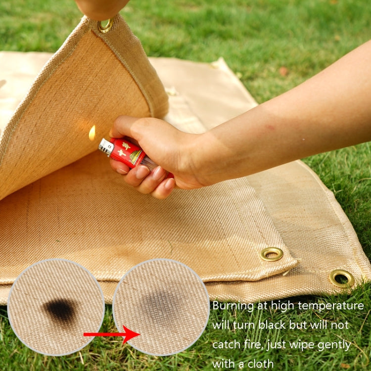 Beige heat insulation cloth pad with corner grommets in use for grilling.