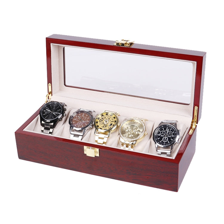Red wooden watch and jewelry display box with clear lid showing multiple wristwatches
