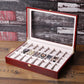 Red wooden watch box open with clear window lid and multiple watch slots on liner