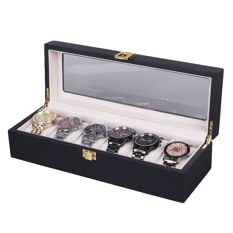 Black wooden watch box open with clear window lid and multiple watches in slots