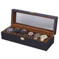 Brown-lined black wooden watch display box with clear lid and watch compartments
