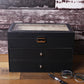 Black PU leather glasses case with hinged top window and front storage drawers