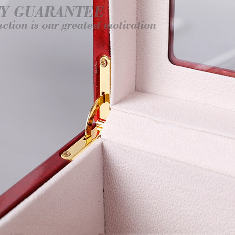 Gold hinge and latch detail on red wooden glasses storage case interior