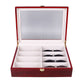 Red wooden glasses case open with clear window lid and sunglasses in compartments