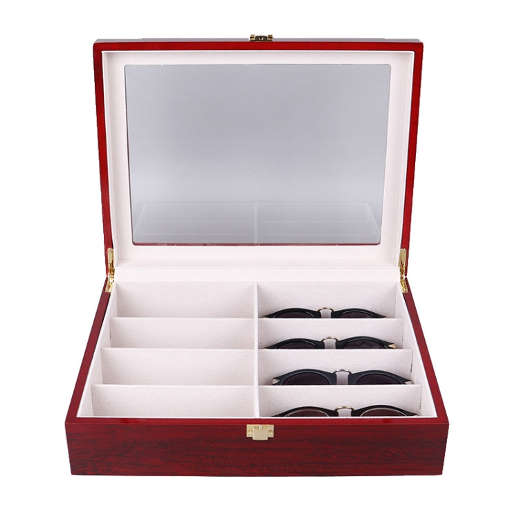 Red wooden glasses case open with clear window lid and sunglasses in compartments