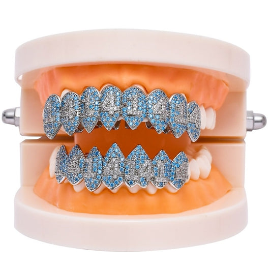 Platinum and blue rhinestone teeth grill braces on white retainer frame