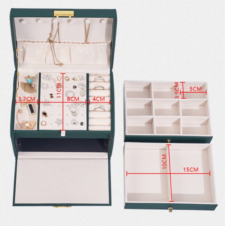 Dark green jewelry storage box open with tiered compartments and interior organizer
