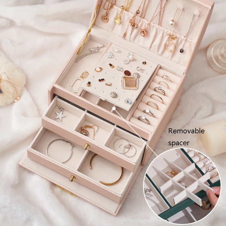 Nude pink jewelry storage box open with removable spacer and ring/earring slots