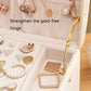 Nude pink jewelry storage box interior with gold-tone hinge and compartment dividers