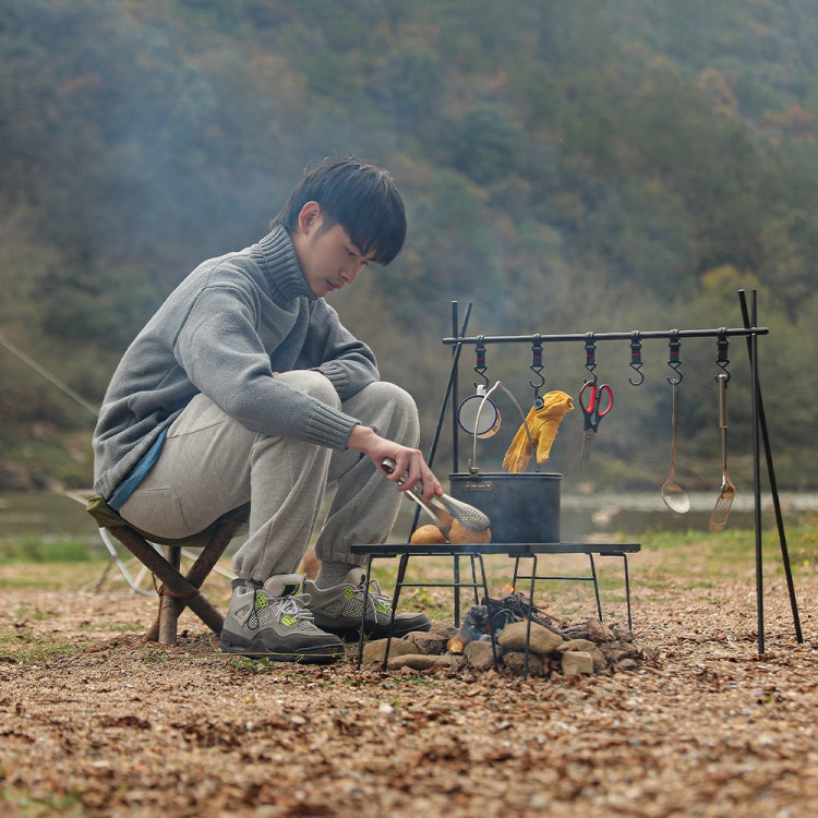 Olive green triangular stool cloth cover on a camping stool setup