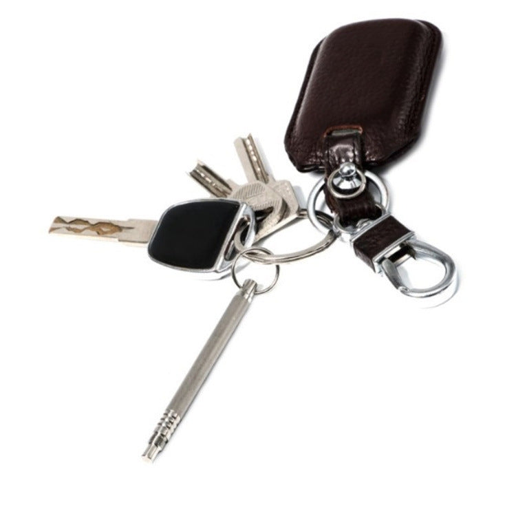 Metal toothpick holder keychain attached to keyring with keys and brown leather pouch