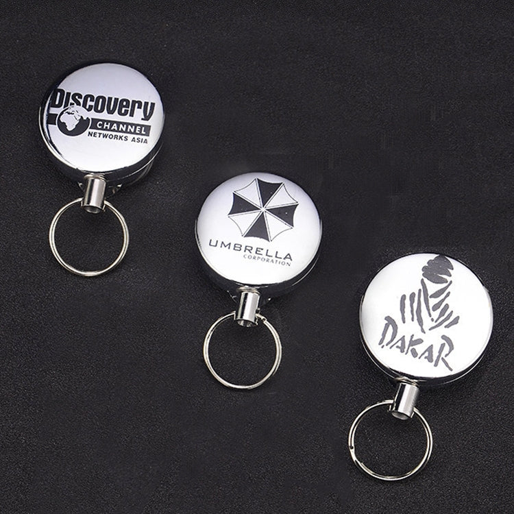 Retractable wire-rope key ring with round printed badge and metal key loop