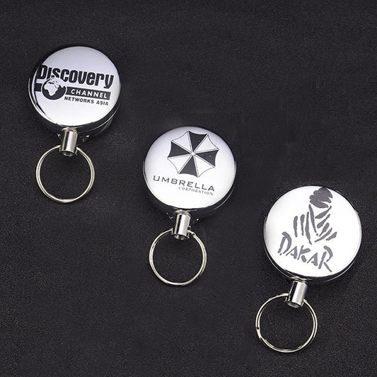 Retractable wire-rope key ring with round printed badge and metal key loop