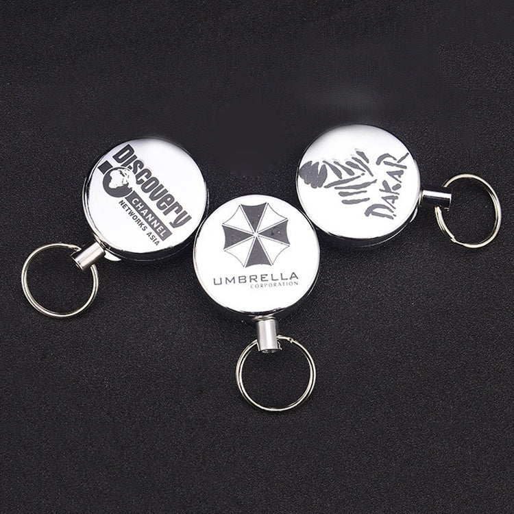 Set of retractable wire-rope key rings with round printed emblems and split rings