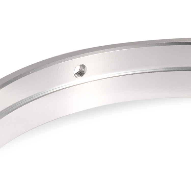Silver motorcycle headlight ring bracket close-up of mounting hole