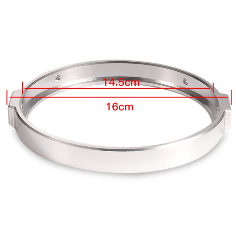 Silver round motorcycle headlight ring showing size markings and mounting tabs