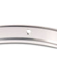 Close-up of silver motorcycle headlight ring with central mounting hole